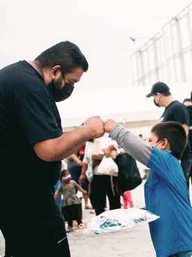 image of two people fist bumping